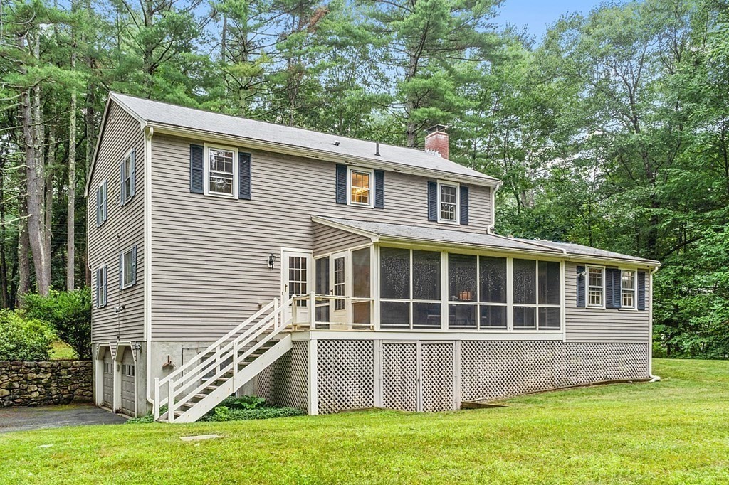 100 Chester Road Boxborough, MA 01719 - Photo 3 of 40 a front view of a house with a yard