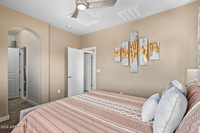 a bedroom with a bed and a couch