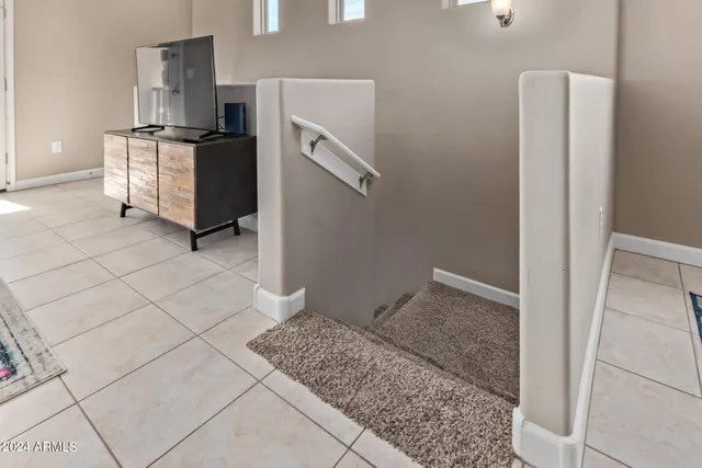 a kitchen with a refrigerator and cabinets