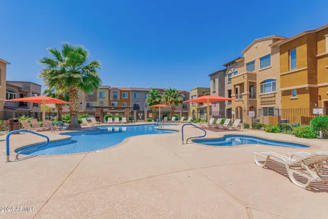 a living room filled with furniture and a fireplace