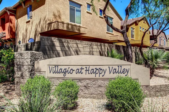 a view of a swimming pool with outdoor seating