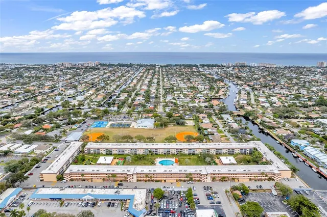 an aerial view of residential building and lake
