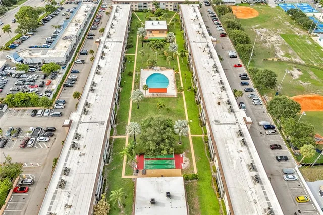 a room with pool table and windows