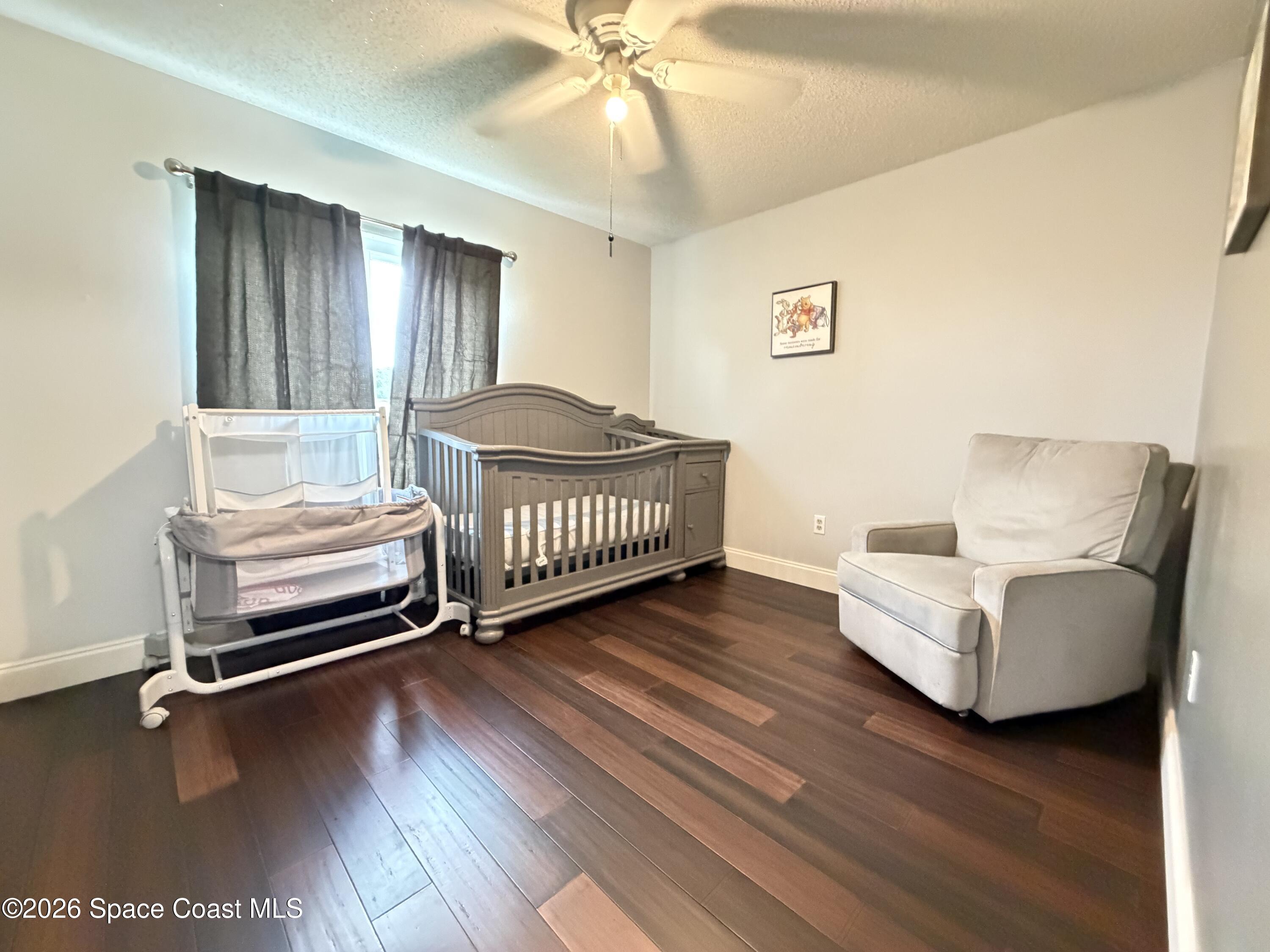 1578 West Powder Horn Road Titusville, FL 32796 - Photo 15 of 22 a living room with furniture and a ceiling fan