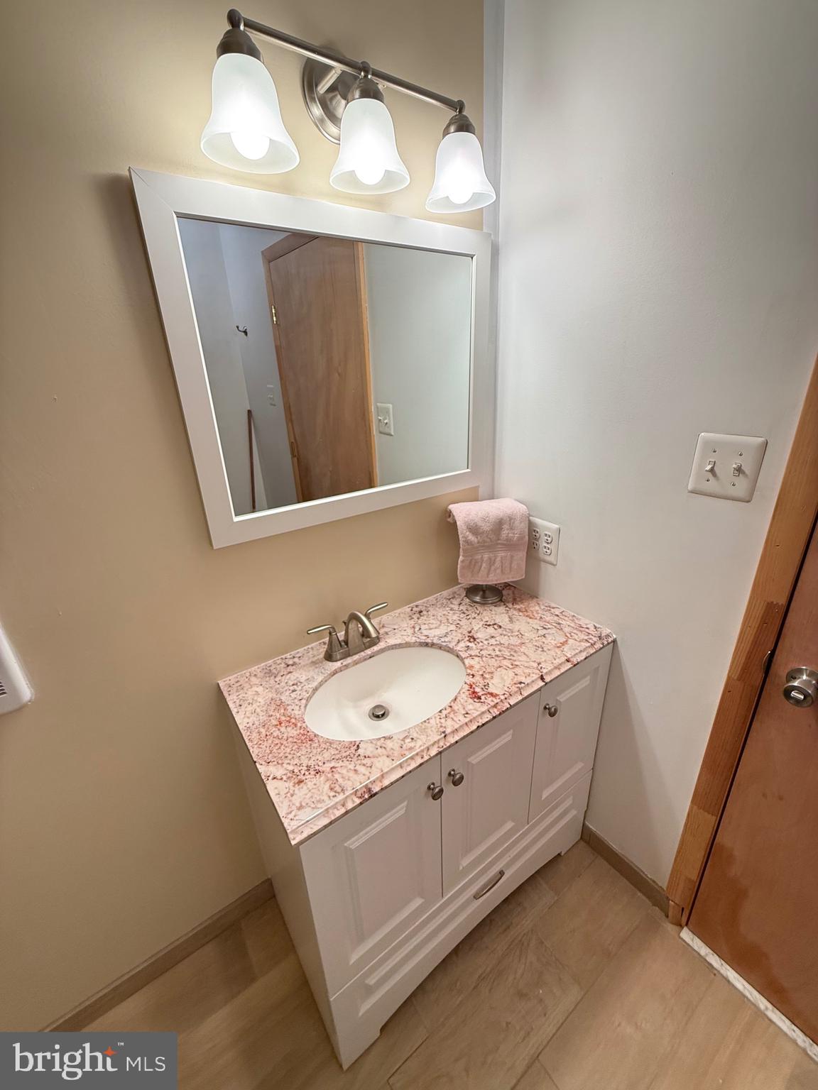 106 North Rock Ridge Lane Mount Storm, WV 26739 - Photo 26 of 78 a bathroom with a sink and a mirror