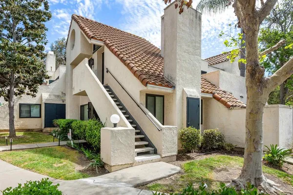an empty room with wooden floor and white walls