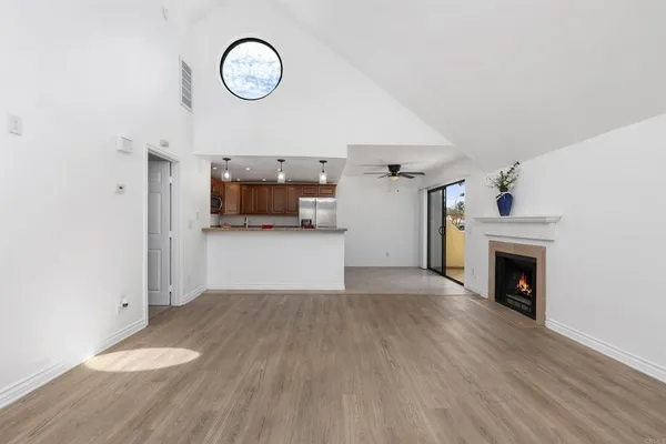 a kitchen with granite countertop a stove and a microwave