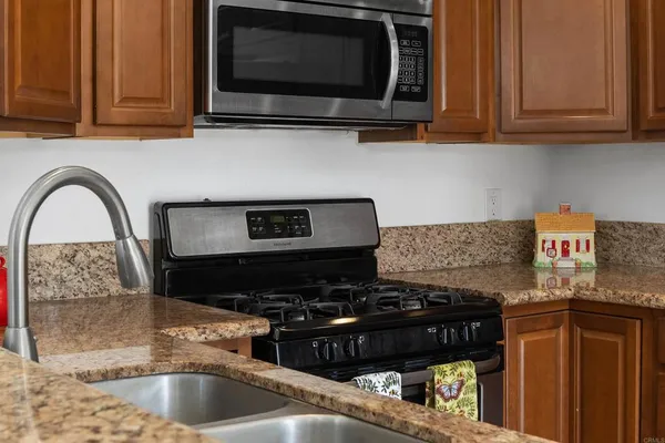 a view of an empty room with a fireplace