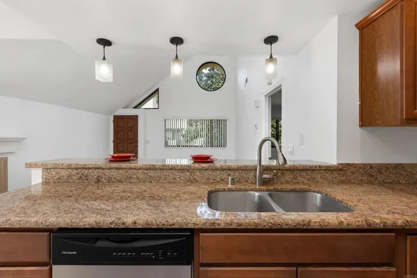 a view of a livingroom with a ceiling fan and window