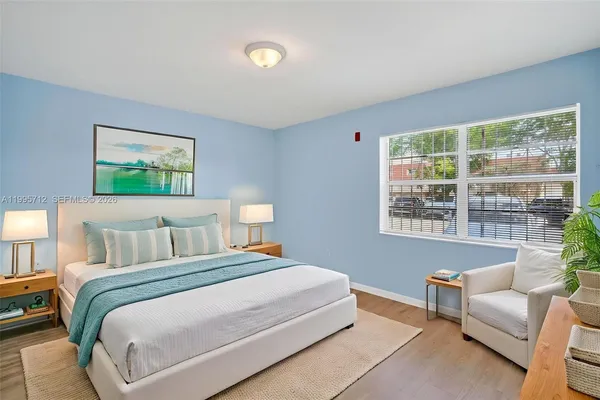 a bedroom with a bed and a couch
