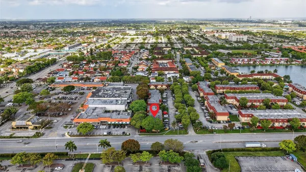 an aerial view of residential building and lake