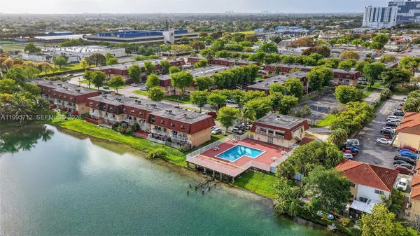 an aerial view of a house with a lake view