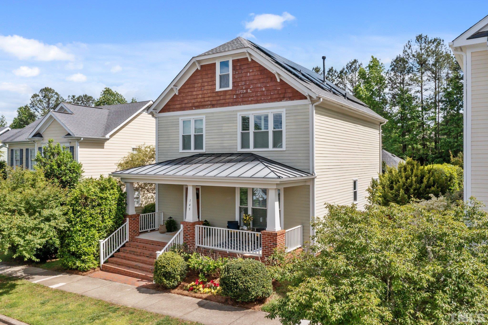 145 Kingsport Road Holly Springs, NC 27540 - Photo 1 of 42 a front view of a house with garden