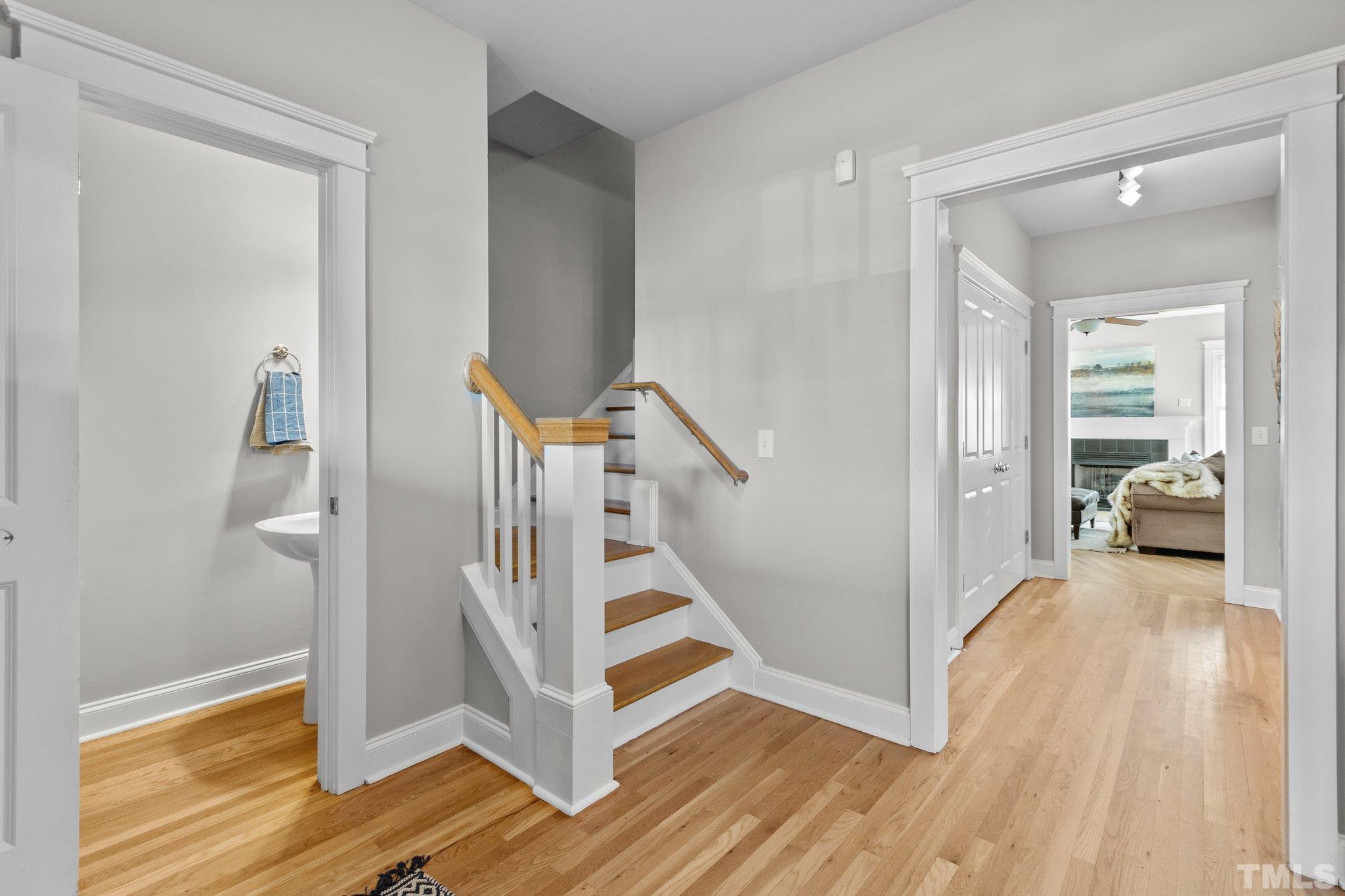 145 Kingsport Road Holly Springs, NC 27540 - Photo 17 of 42 a view of a hallway view with wooden floor and staircase