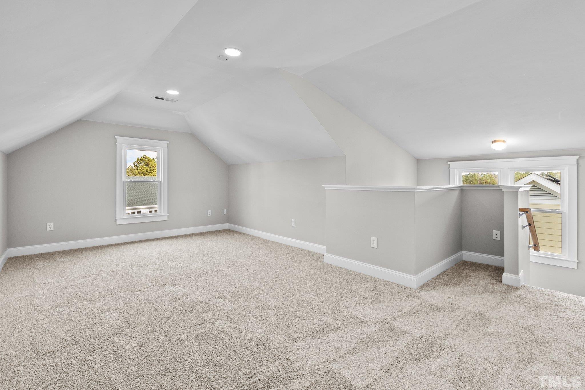 145 Kingsport Road Holly Springs, NC 27540 - Photo 21 of 42 an empty room with windows and closet