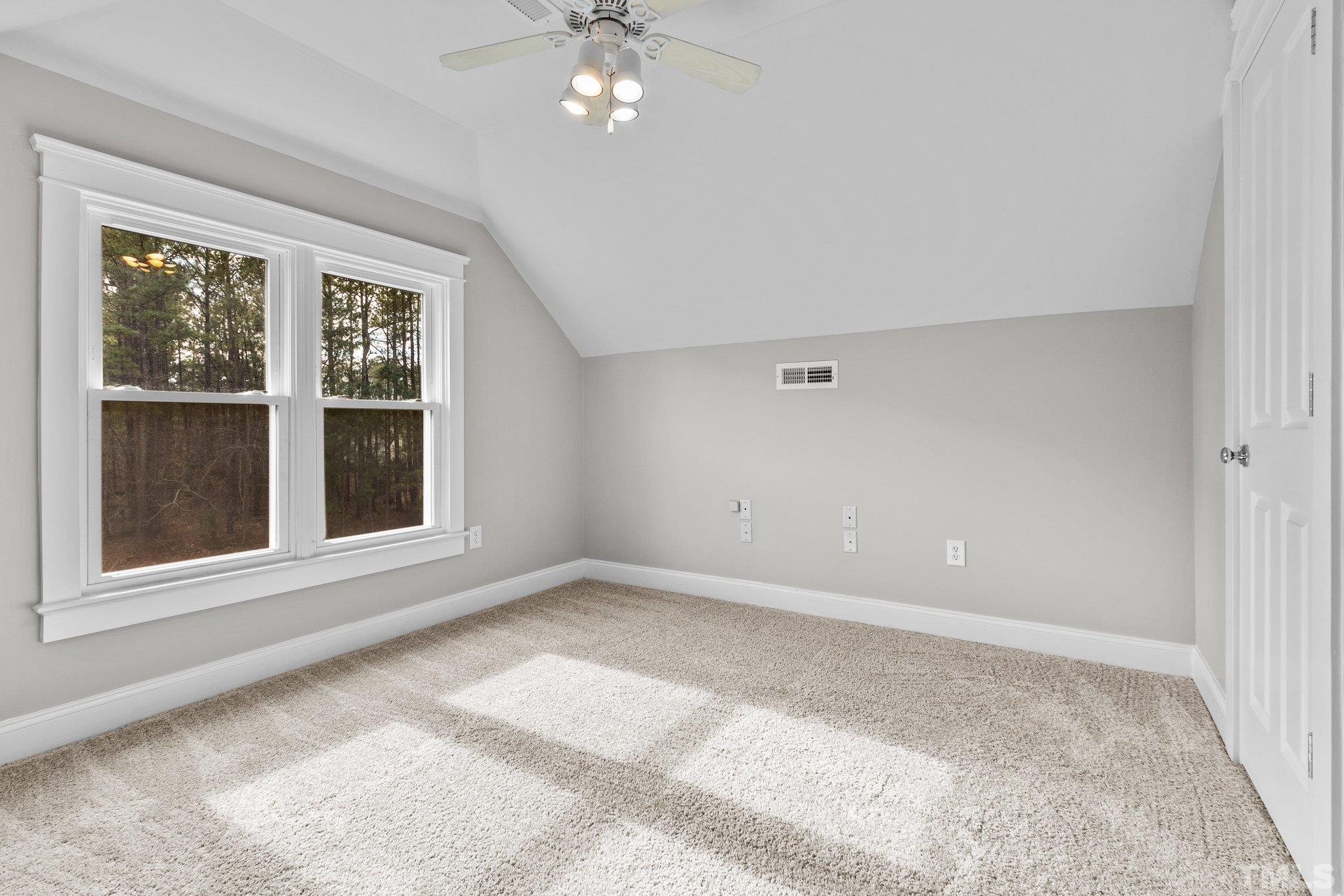 145 Kingsport Road Holly Springs, NC 27540 - Photo 23 of 42 a view of an empty room with a window