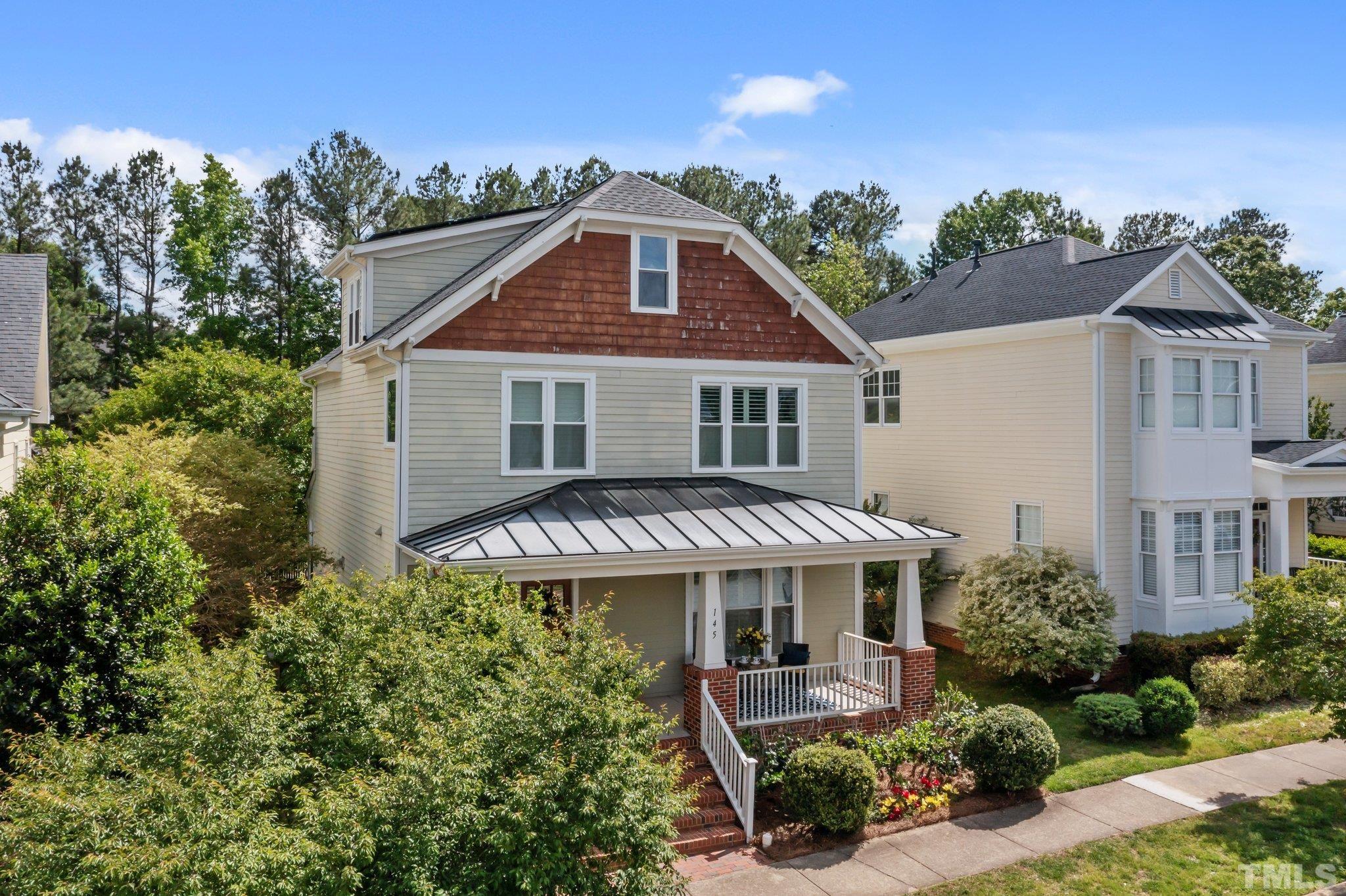145 Kingsport Road Holly Springs, NC 27540 - Photo 4 of 42 an aerial view of a house with yard and green space