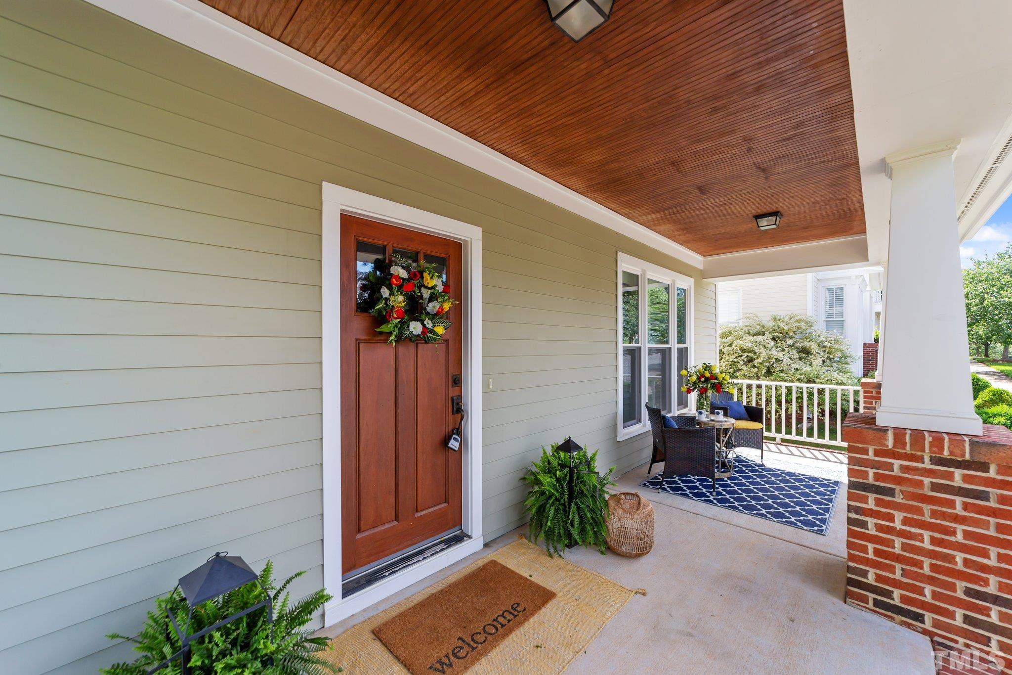 145 Kingsport Road Holly Springs, NC 27540 - Photo 6 of 42 a view of a porch with furniture