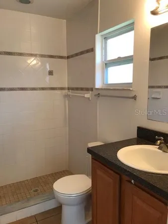 a bathroom with a sink a toilet and a bathtub