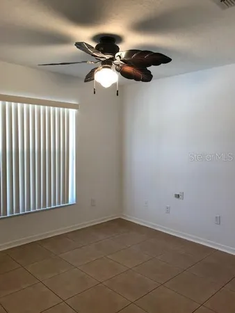 a view of storage and utility room with racks on the wall
