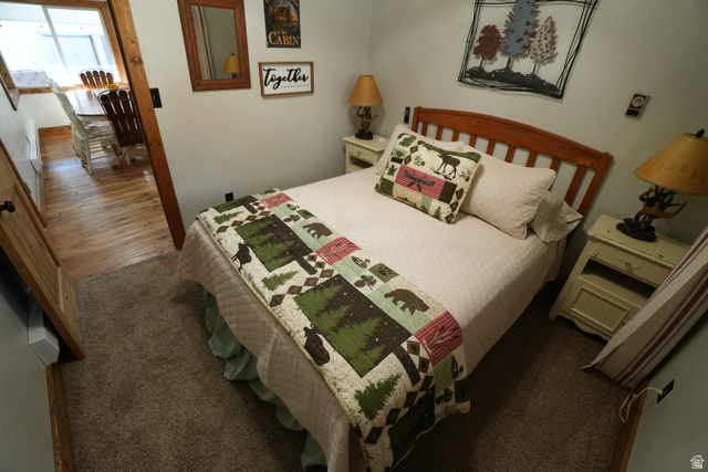 3711 North Canyon Road Provo, UT 84604 - Photo 19 of 42 Bedroom with dark colored carpet and dark wood-style floors