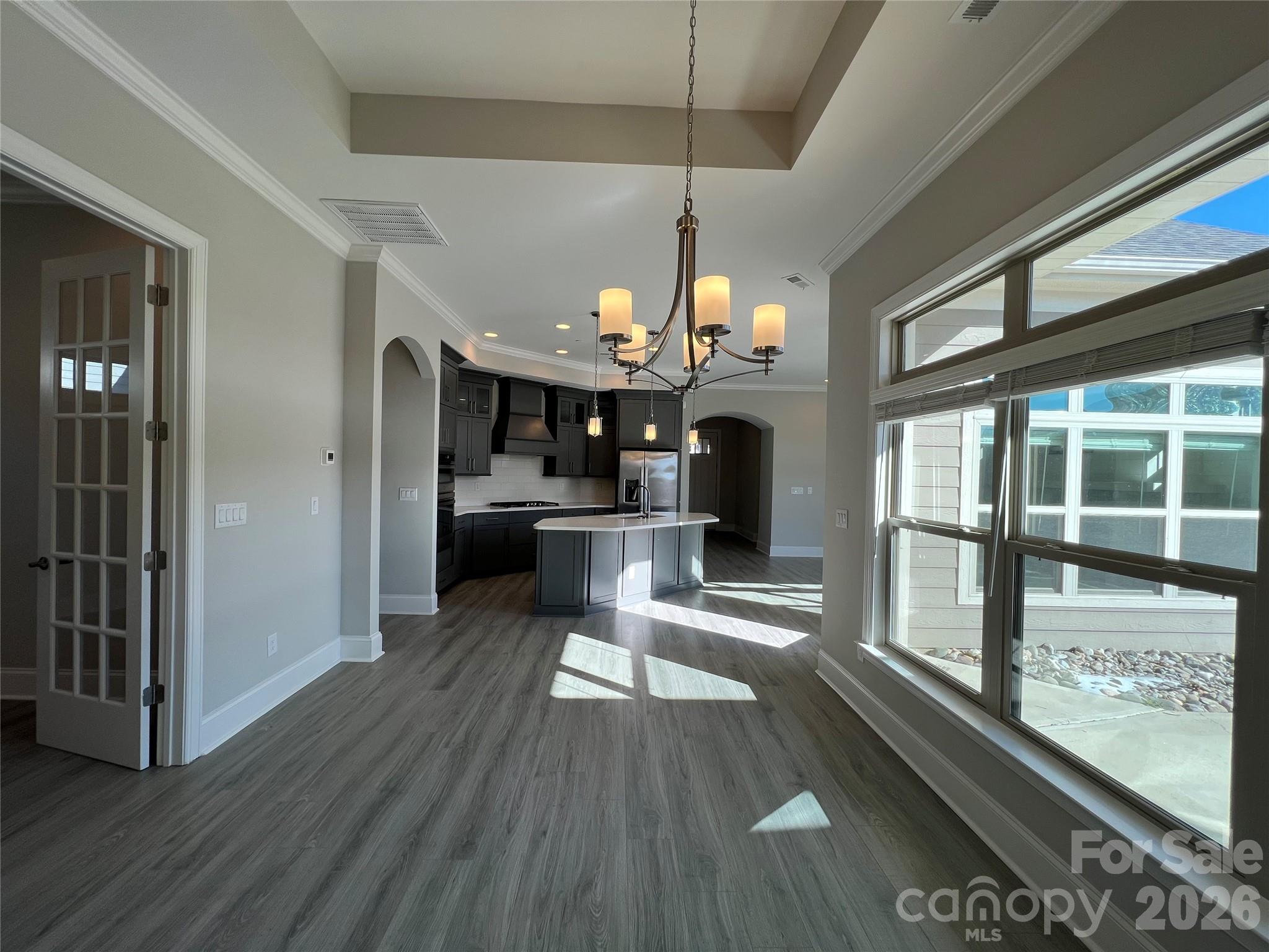 9049 Treetop Way Northwest Concord, NC 28027 - Photo 13 of 42 a view of a kitchen and dining room
