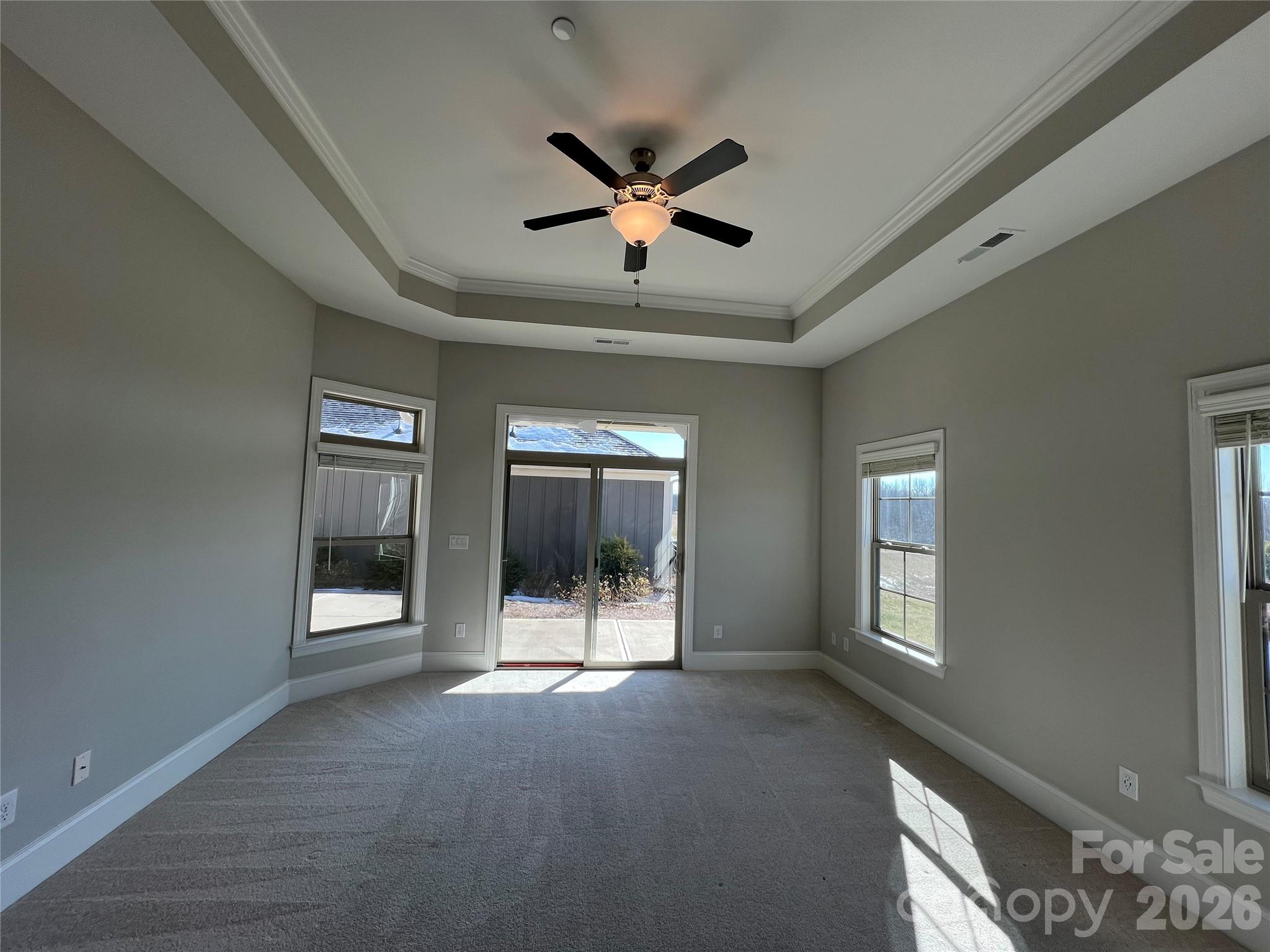 9049 Treetop Way Northwest Concord, NC 28027 - Photo 18 of 42 a view of a livingroom with a ceiling fan and window