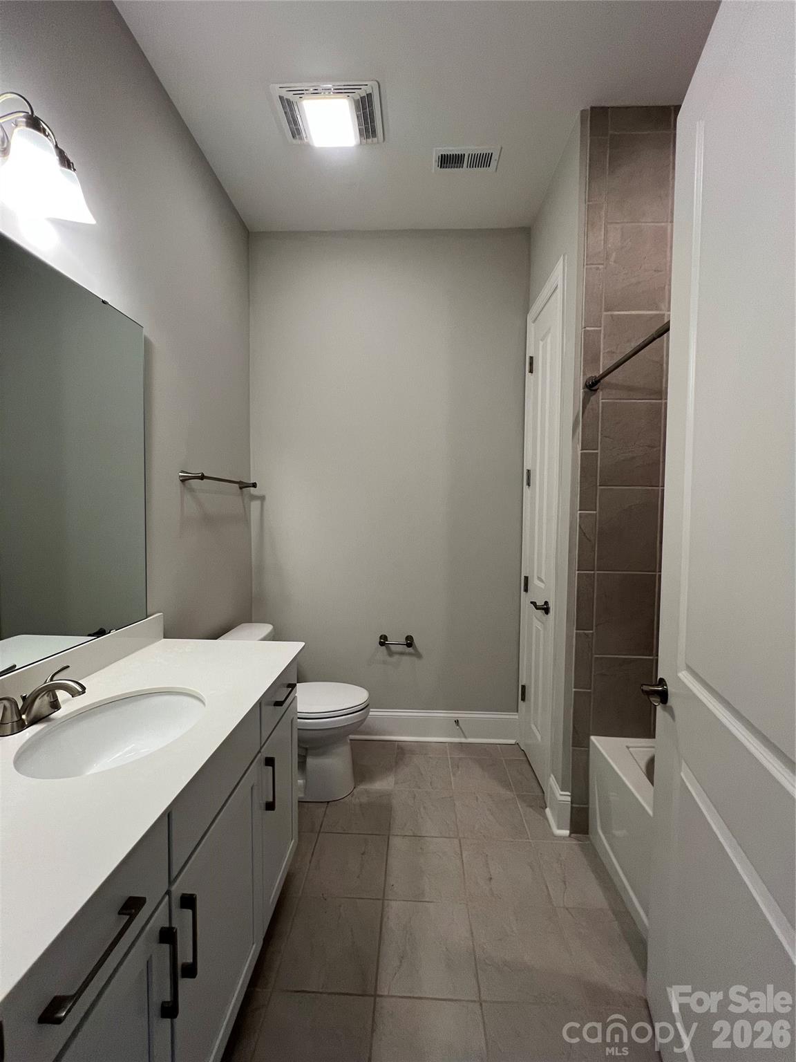 9049 Treetop Way Northwest Concord, NC 28027 - Photo 24 of 42 a bathroom with a sink a toilet and shower