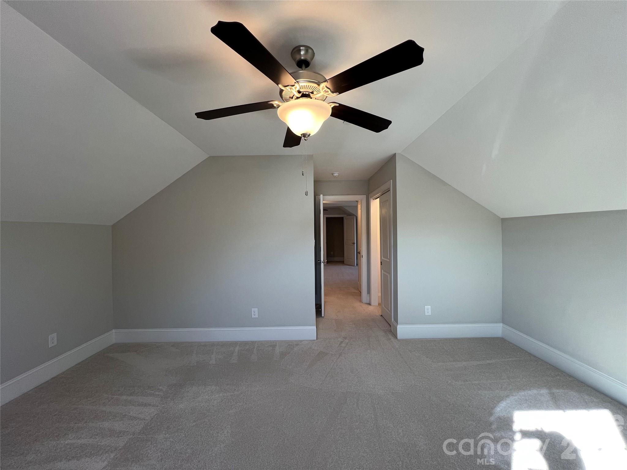 9049 Treetop Way Northwest Concord, NC 28027 - Photo 29 of 42 a view of an empty room and kitchen view