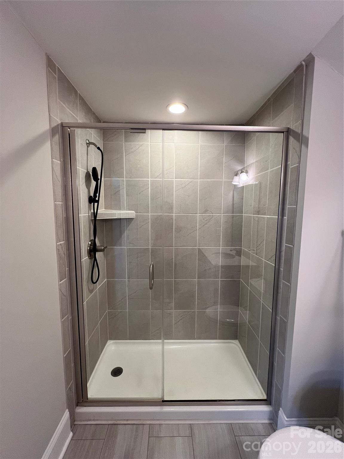 9049 Treetop Way Northwest Concord, NC 28027 - Photo 32 of 42 a bathroom with a shower and toilet