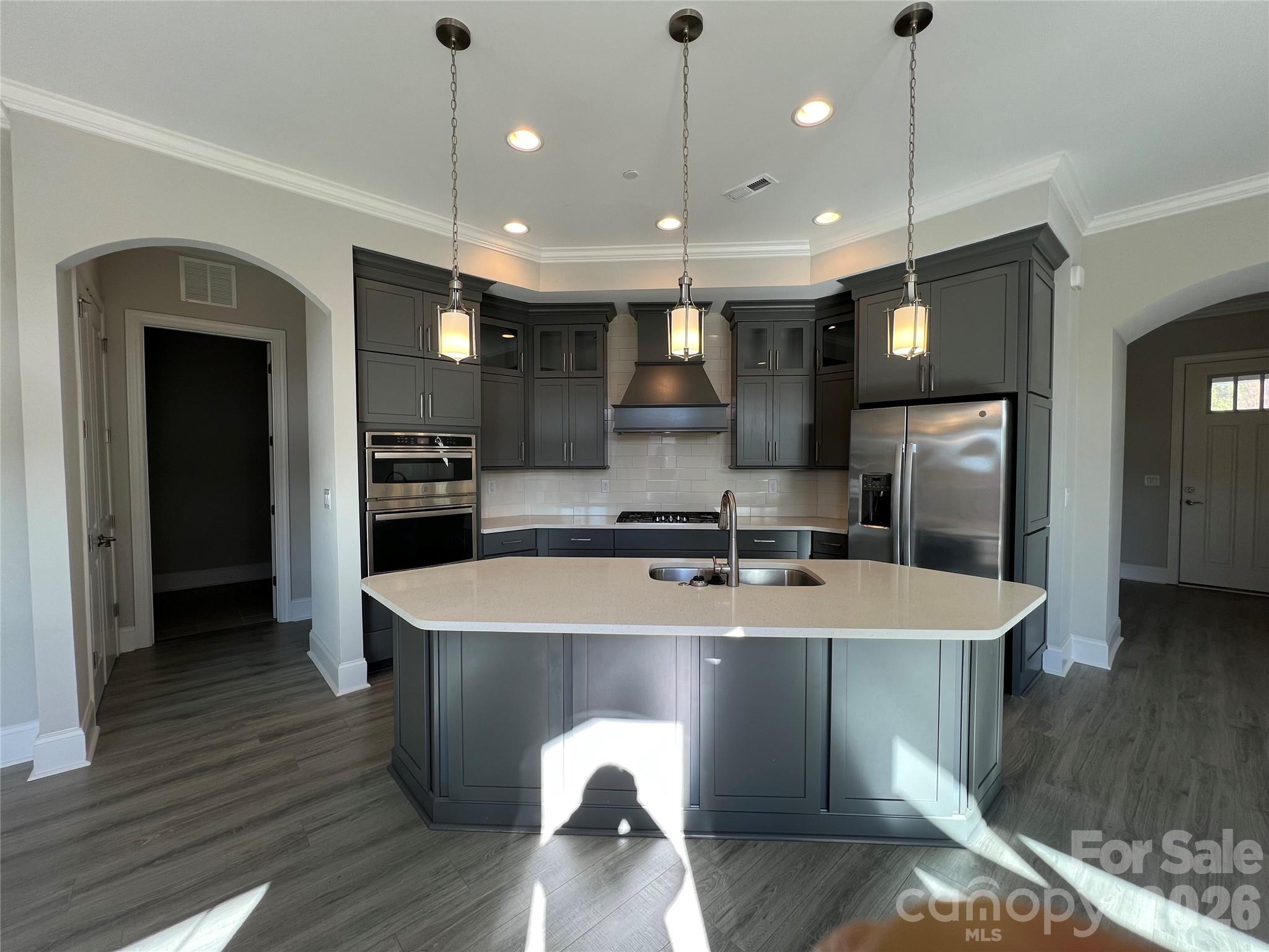 9049 Treetop Way Northwest Concord, NC 28027 - Photo 10 of 42 a large kitchen with a table and chairs
