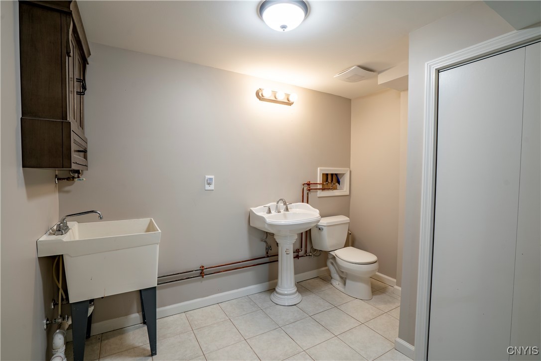 5039 Briarledge Road Syracuse, NY 13212 - Photo 36 of 43 half bath on lower level and utility room
