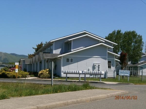821 East Division Street Forks, WA 98331 - Photo 4 of 7 a front view of a house with a yard