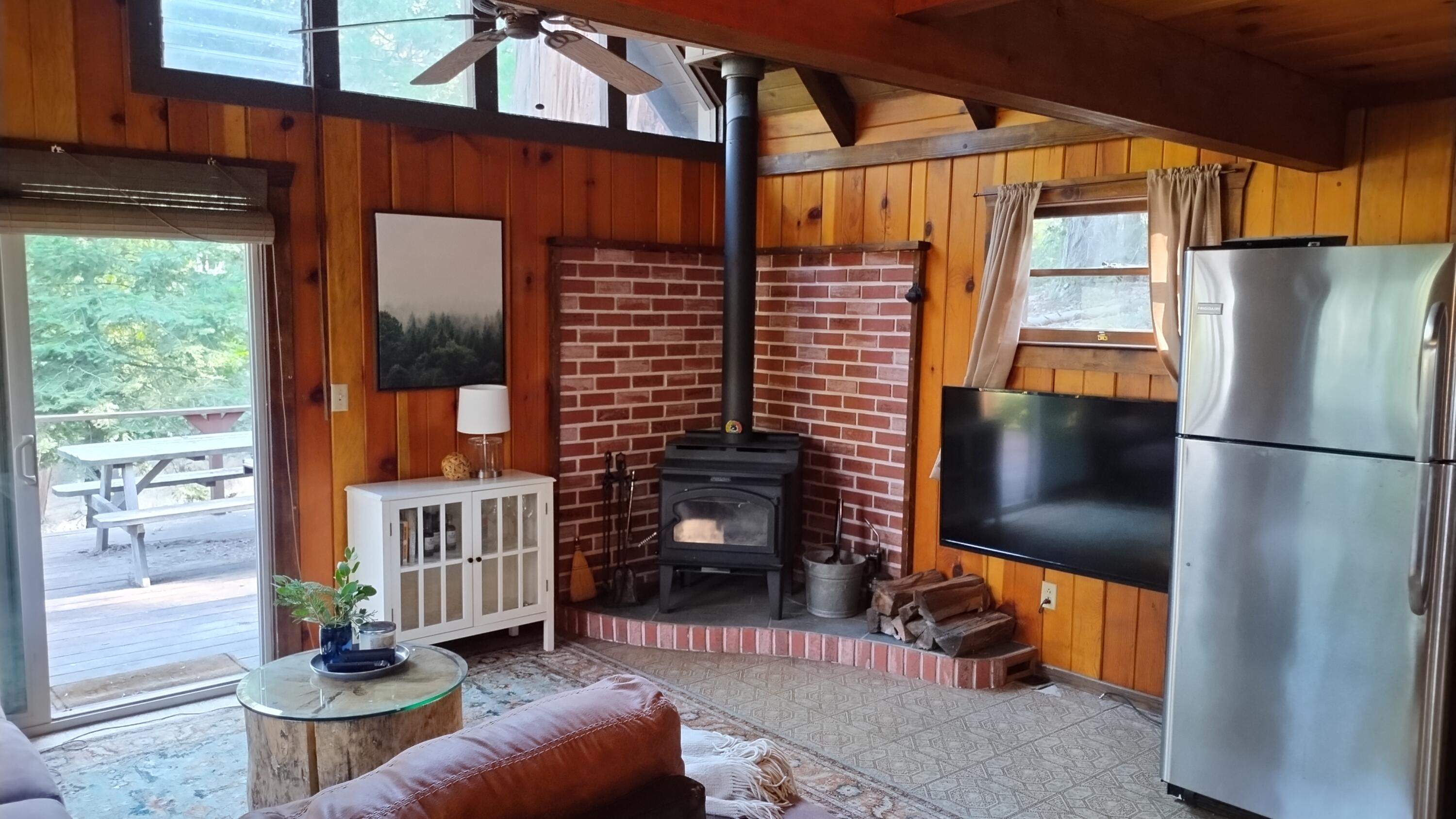 51867 Cedar Road Cedar Slope, CA 93265 - Photo 8 of 38 7-Great room has wood stove and brick he