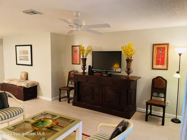 a bathroom with a granite countertop toilet a sink and a mirror