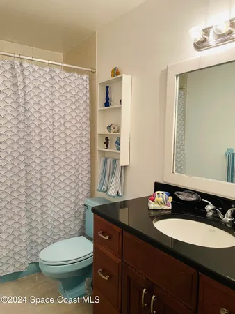 a bedroom with a bed and dresser