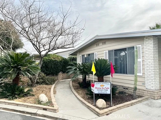 a front view of a house with outdoor seating