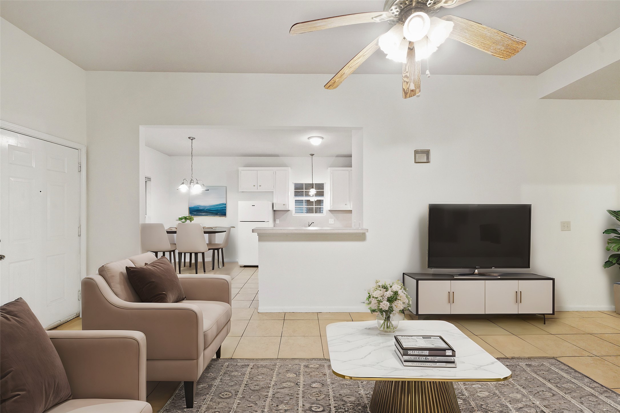 5502 Finch Street, Unit B Houston, TX 77028 - Photo 9 of 37 a living room with furniture and a flat screen tv