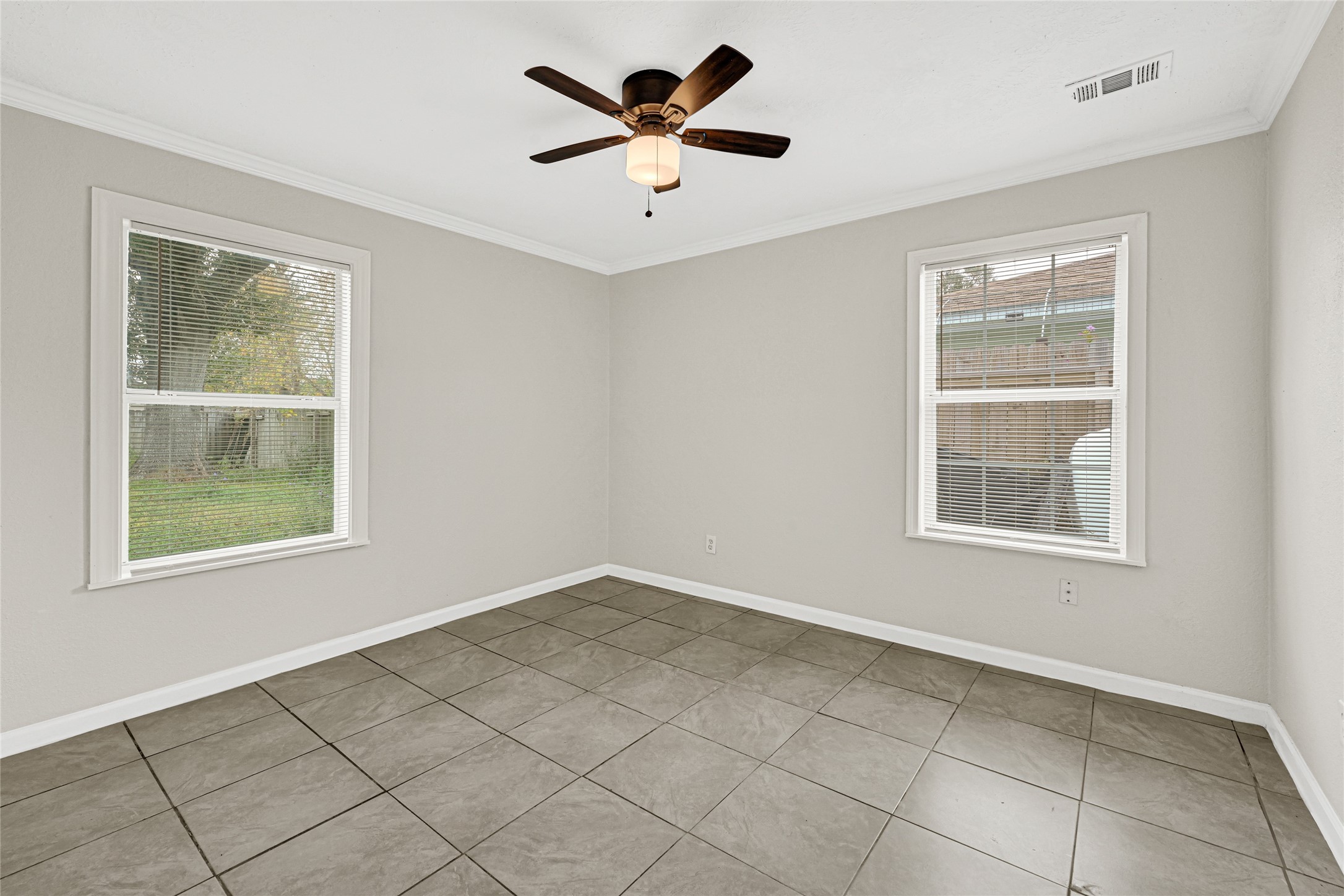 2207 Raymond Street Pasadena, TX 77506 - Photo 12 of 21 a view of an empty room with a window
