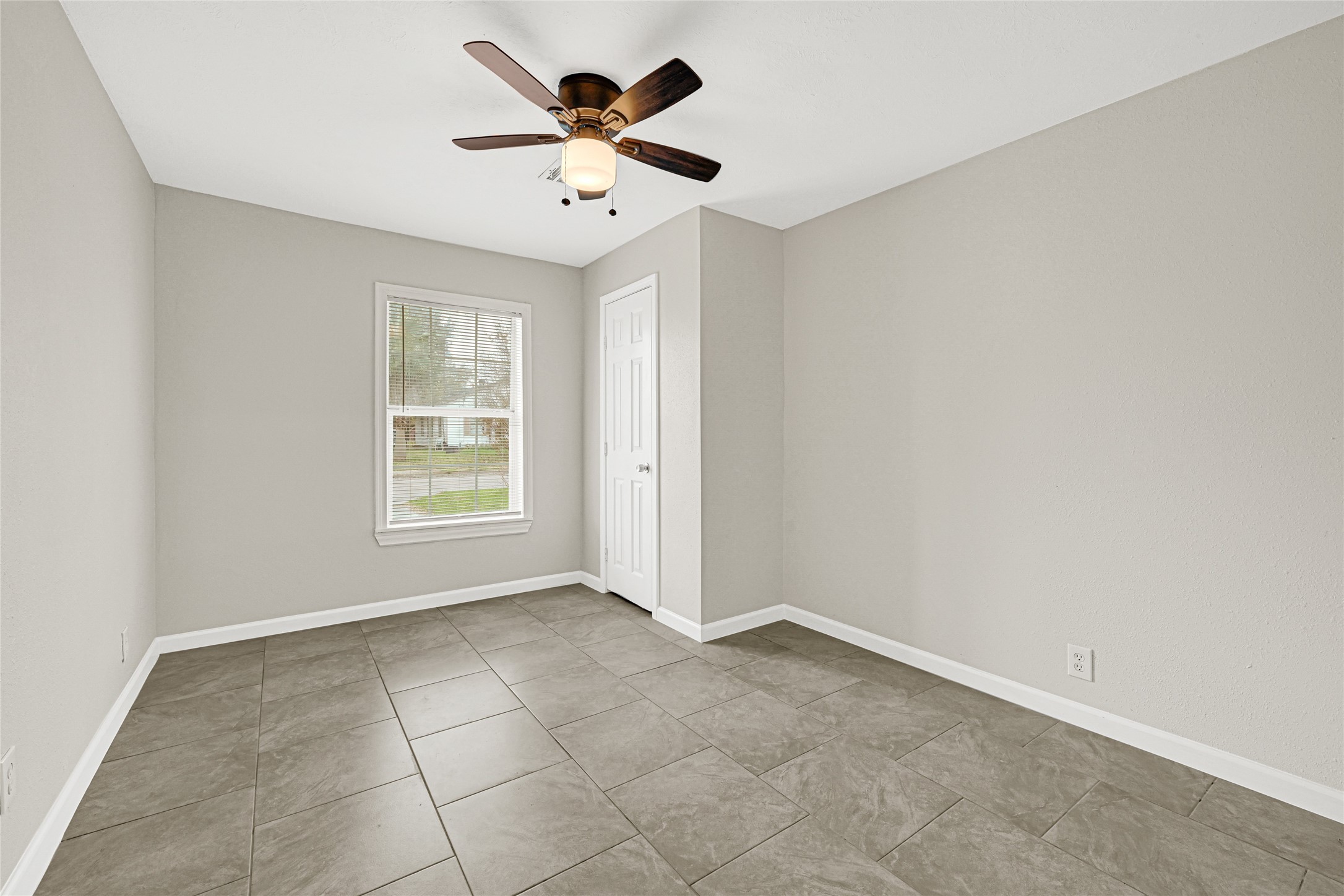 2207 Raymond Street Pasadena, TX 77506 - Photo 15 of 21 an empty room with a window