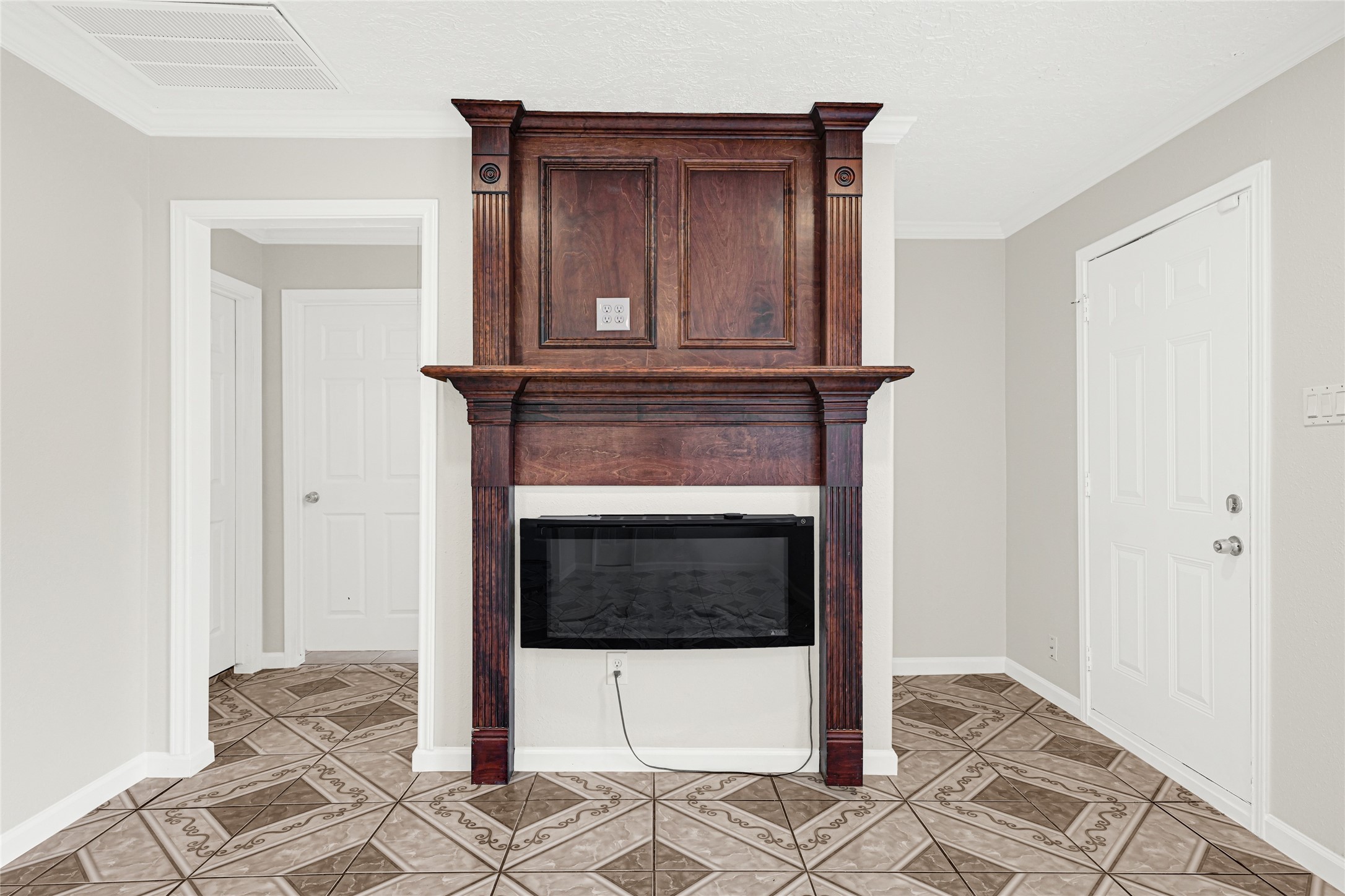 2207 Raymond Street Pasadena, TX 77506 - Photo 6 of 21 a living room with a fireplace and a rug