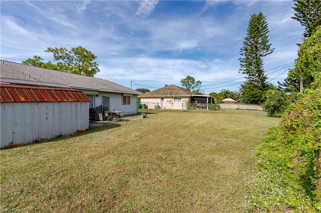 2100 55th Terrace Southwest Naples, FL 34116 - Photo 11 of 33 a house view with a garden space