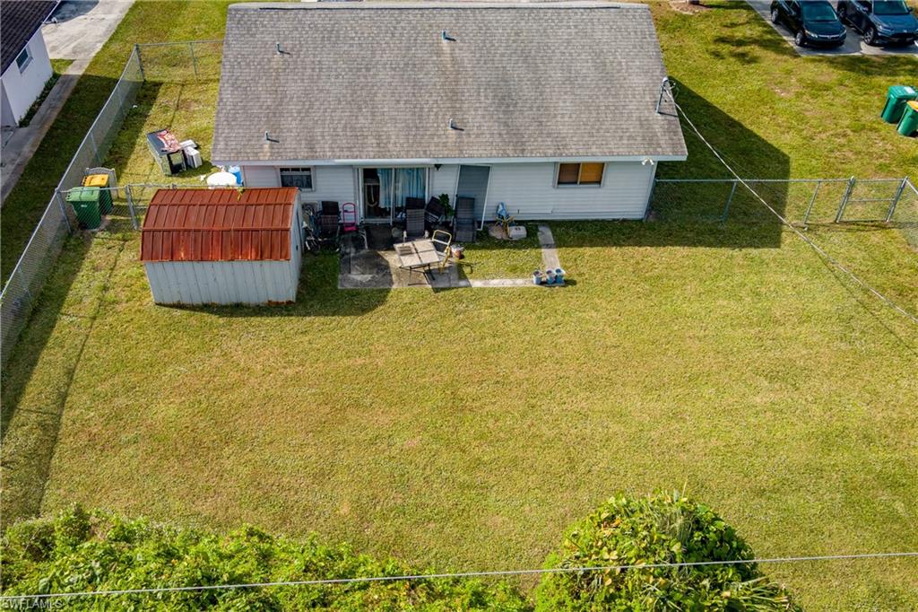 2100 55th Terrace Southwest Naples, FL 34116 - Photo 13 of 33 a swimming pool with outdoor seating