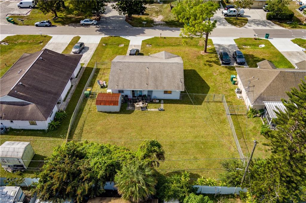 2100 55th Terrace Southwest Naples, FL 34116 - Photo 19 of 33 an aerial view of residential houses with outdoor space and swimming pool