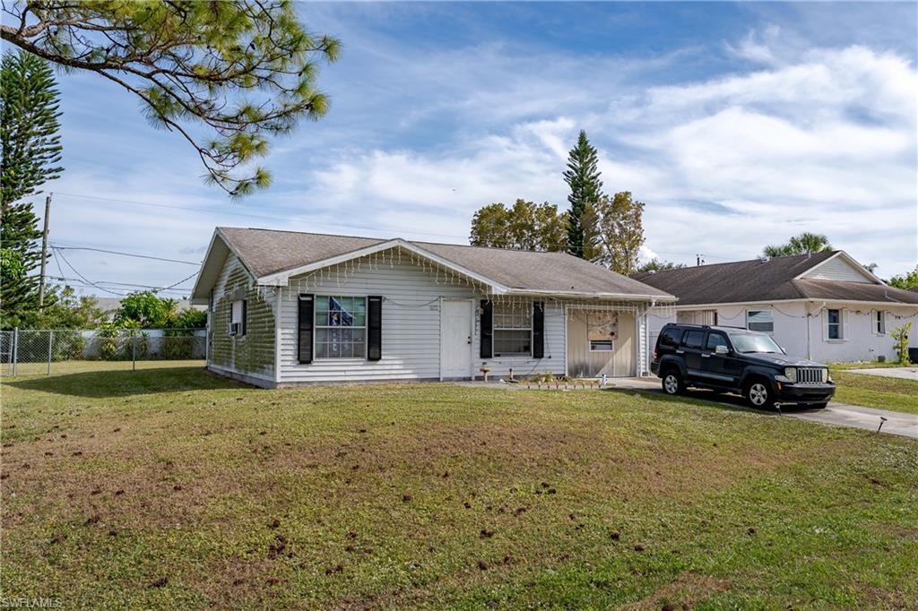 2100 55th Terrace Southwest Naples, FL 34116 - Photo 2 of 33 a view of a house with a yard