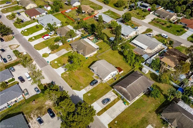 an aerial view of residential house with outdoor space and parking