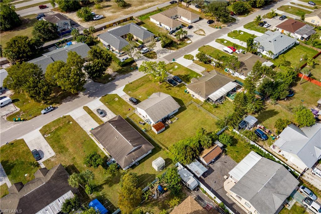 2100 55th Terrace Southwest Naples, FL 34116 - Photo 25 of 33 an aerial view of residential house with outdoor space and parking
