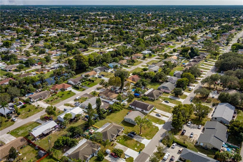 2100 55th Terrace Southwest Naples, FL 34116 - Photo 28 of 33 an aerial view of residential houses with outdoor space