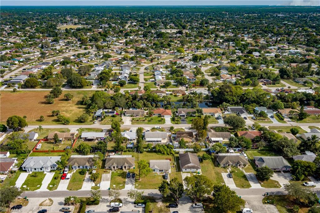 2100 55th Terrace Southwest Naples, FL 34116 - Photo 29 of 33 an aerial view of residential houses with outdoor space