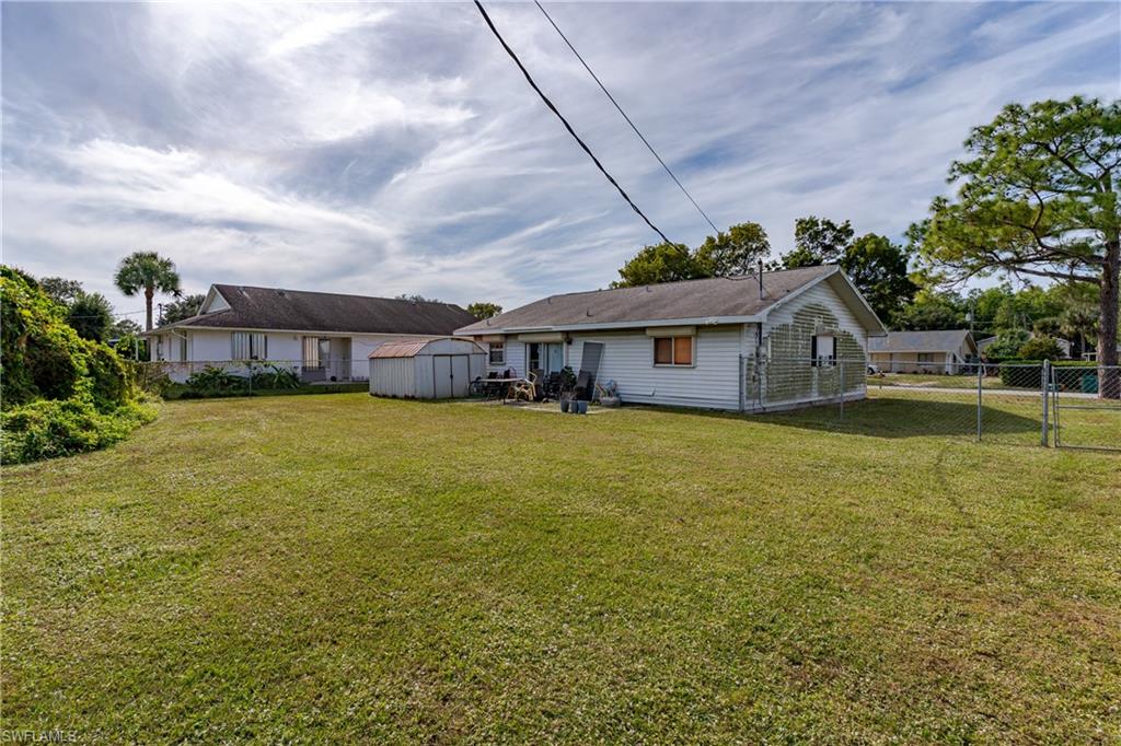 2100 55th Terrace Southwest Naples, FL 34116 - Photo 7 of 33 a front view of a house with garden